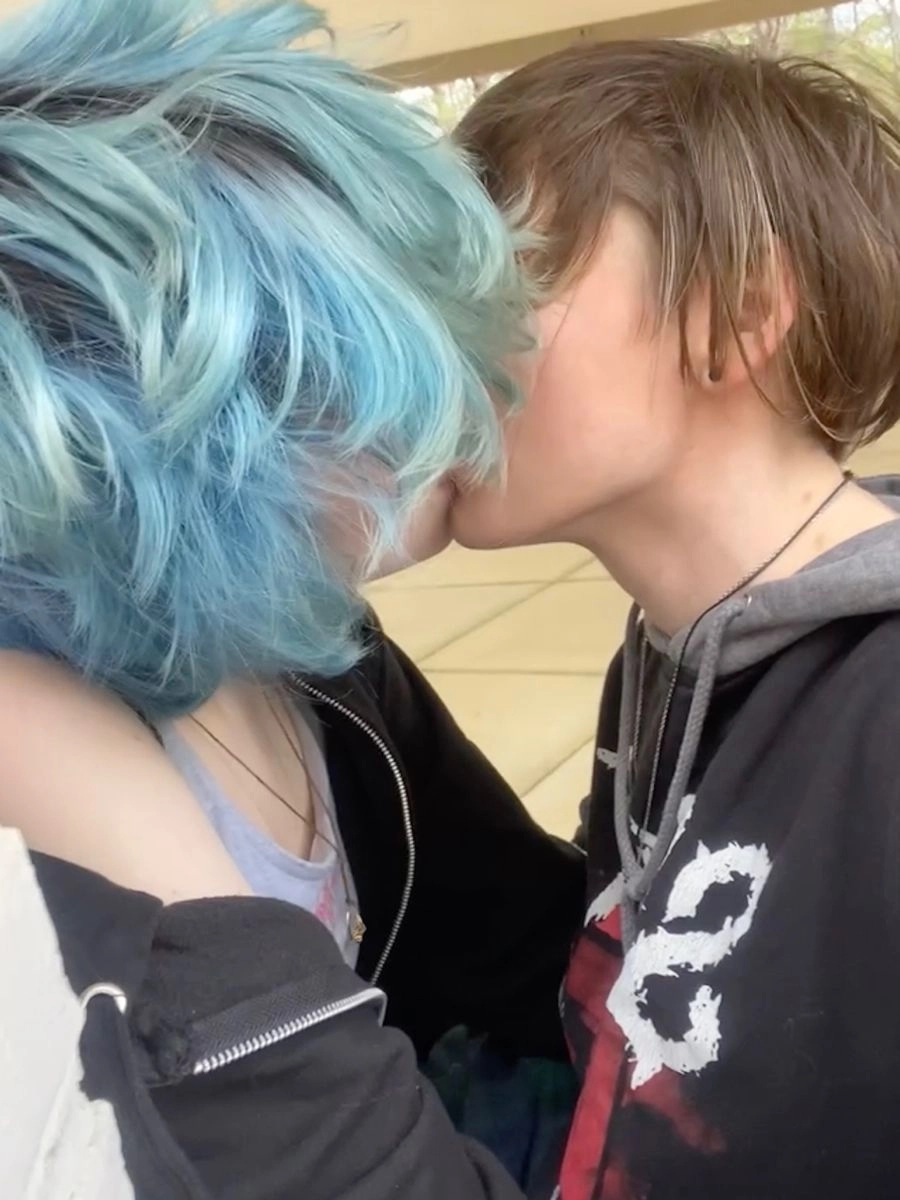 A couple of people that are kissing each other.