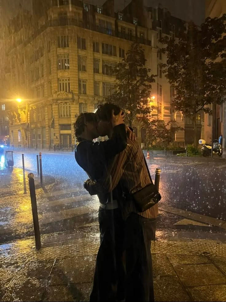A painting of a man kissing a woman in the rain.
