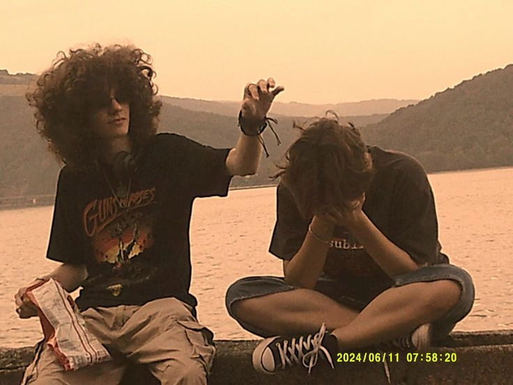 A couple of people sitting on top of a boat.