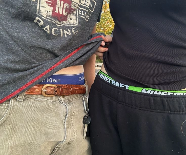 A couple of people that are standing next to each other.