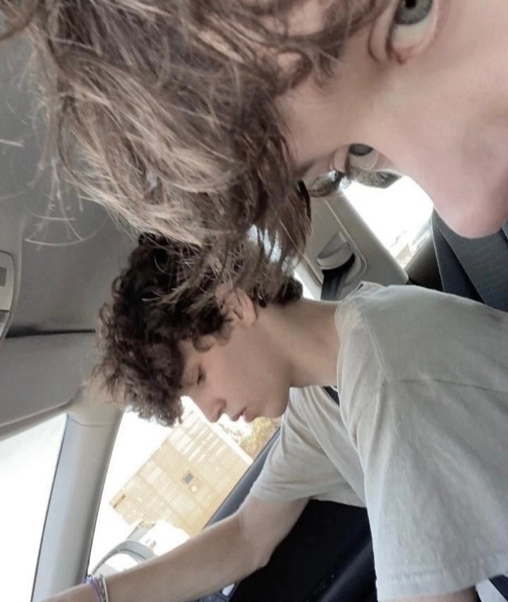 A couple of people that are sitting in a car.