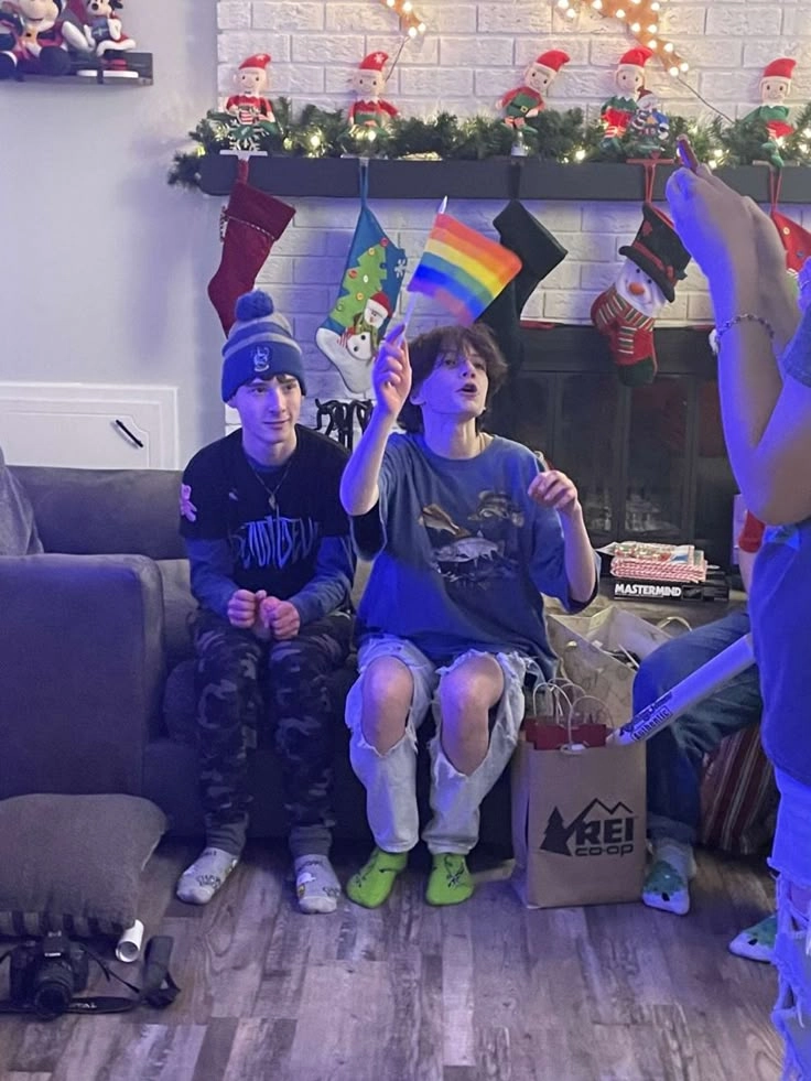 A group of people sitting on top of a couch.