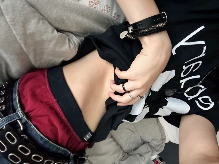 A couple of people that are laying down on a bed.