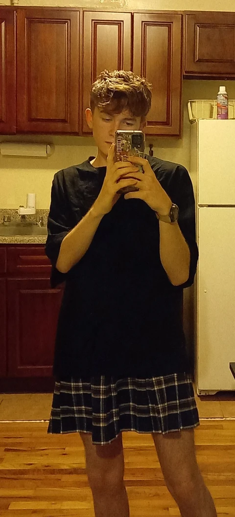 A man taking a picture of himself in a mirror.