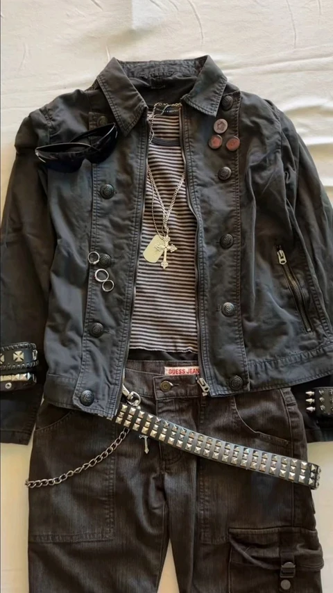 A mannequin wearing a black jacket and pants.