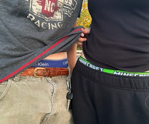 A couple of people that are standing next to each other.