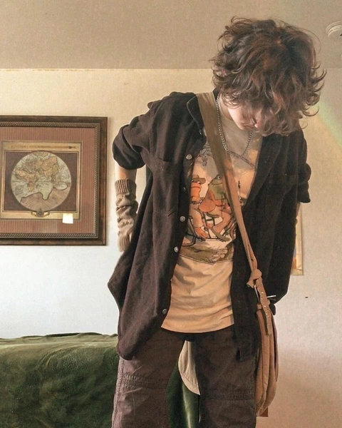 A mannequin wearing a brown jacket and brown pants.