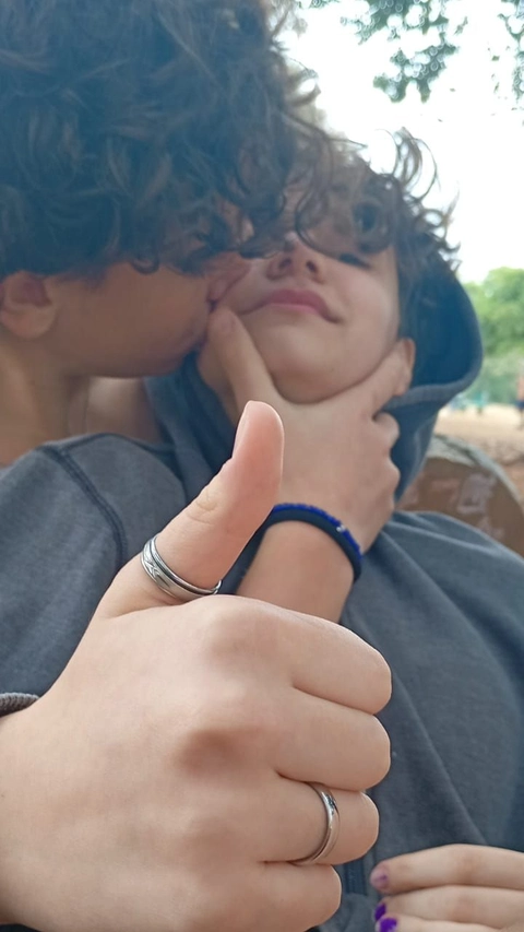 A couple of people that are holding their hands together.