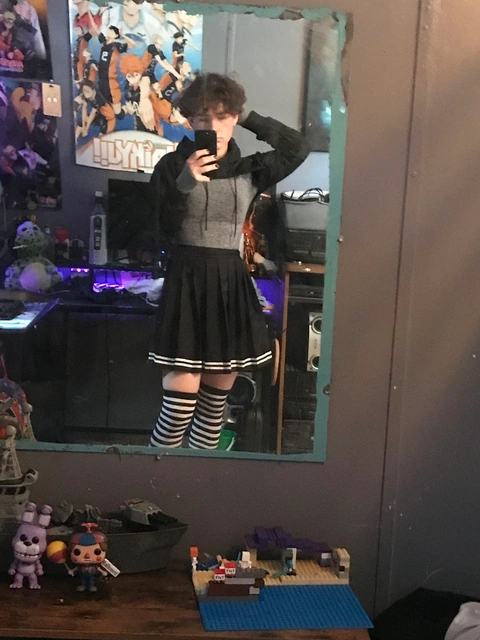 A woman taking a picture of herself in a mirror.