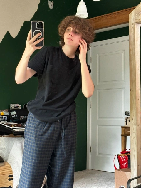 A man taking a picture of himself in a mirror.