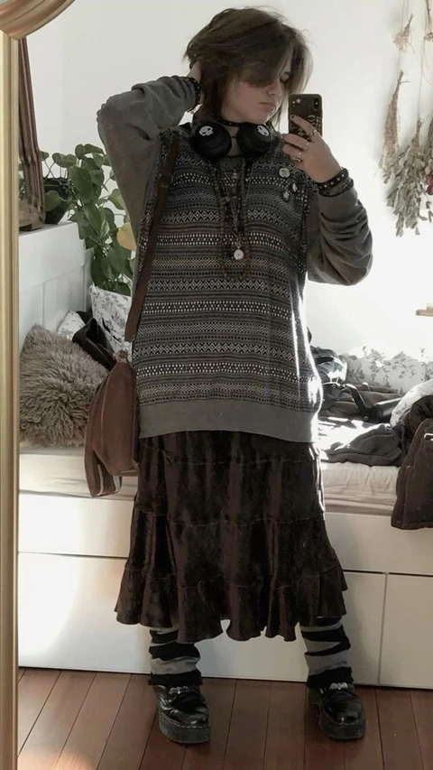 A woman taking a picture of herself in a mirror.
