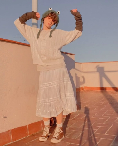 A man and a woman standing next to each other on a roof.