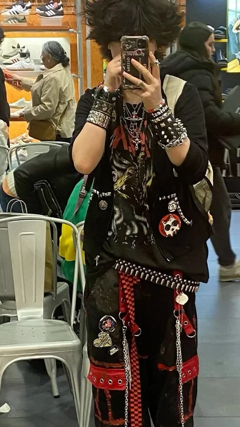 A woman taking a picture of herself in a mirror.