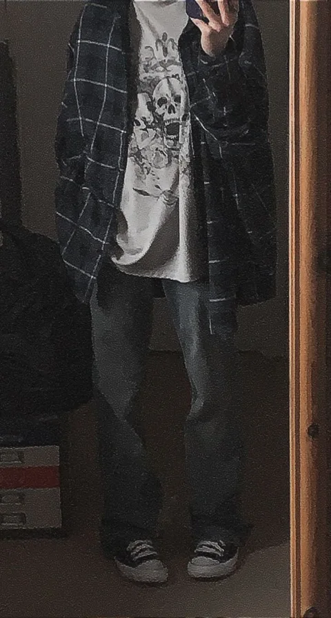a man taking a selfie in front of a mirror