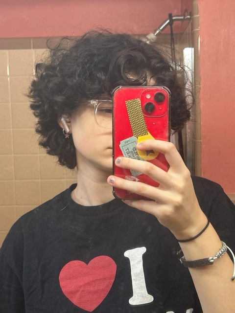 A woman taking a picture of herself in a mirror.