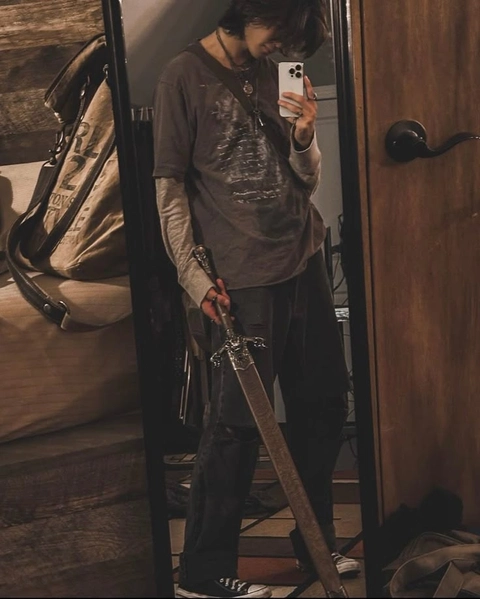 A man taking a picture of himself in a mirror.