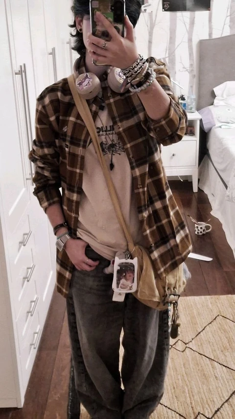A woman taking a picture of herself in a mirror.