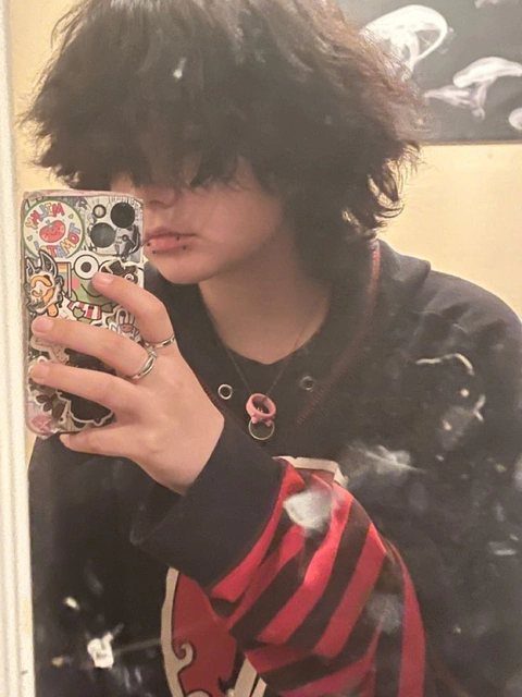 A woman taking a picture of herself in a mirror.