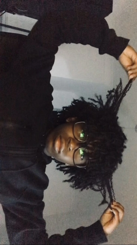 A reflection of a person with long black hair.