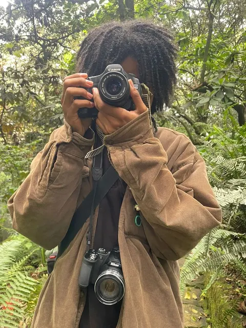 A man taking a picture of himself with a camera.