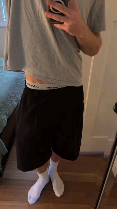 A man taking a selfie in a mirror.