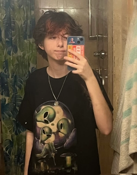 A man taking a picture of himself in a mirror.