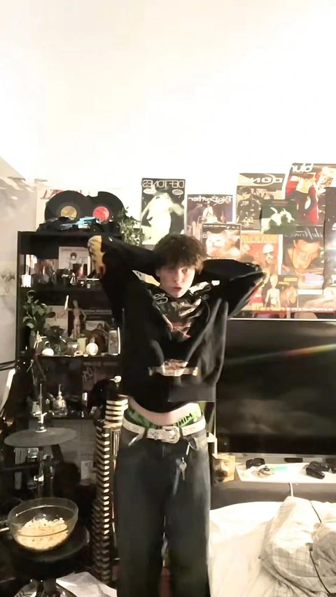 A mannequin dressed as a woman in a black outfit.
