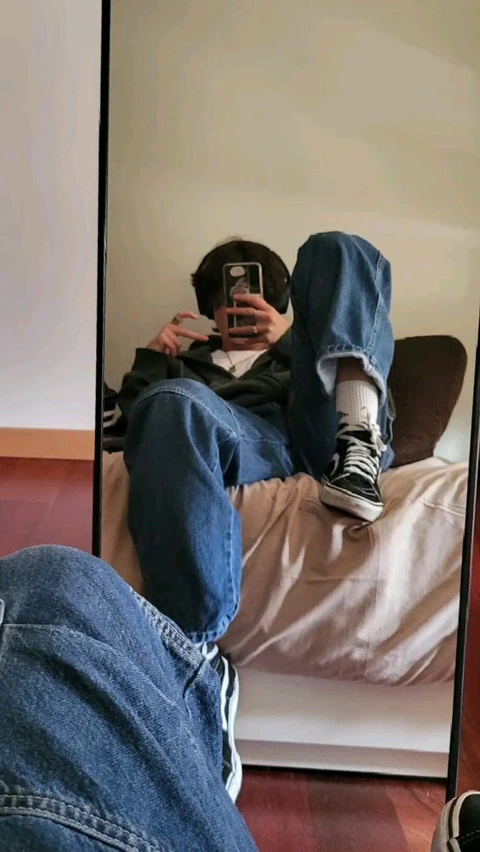 A person taking a picture of themselves in a mirror.