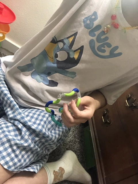 A person holding a toy in their hand.