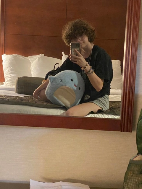 A woman taking a picture of herself in a mirror.