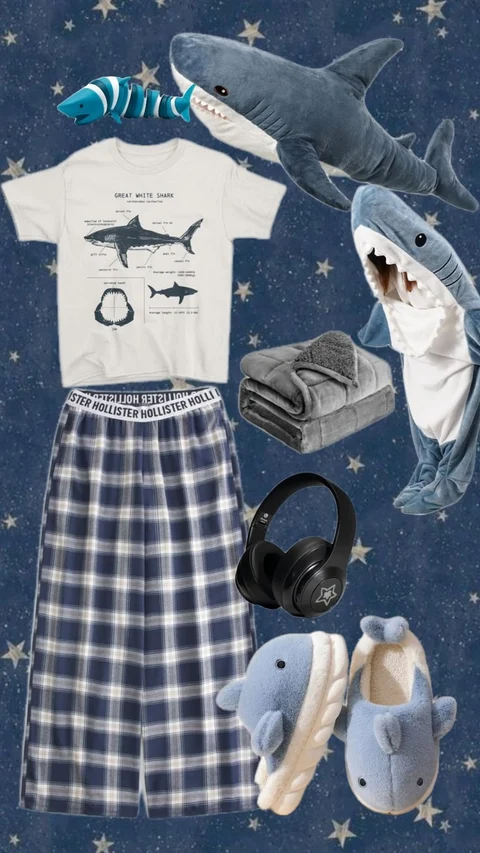 A group of shark themed items including a t-shirt, shorts, and headphones.