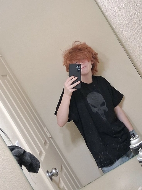 A woman taking a picture of herself in a mirror.