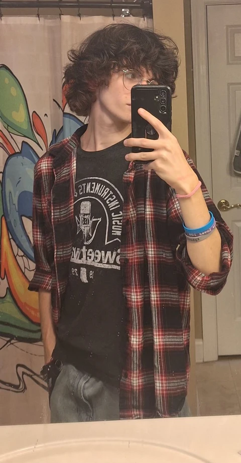 A man taking a picture of himself in a mirror.
