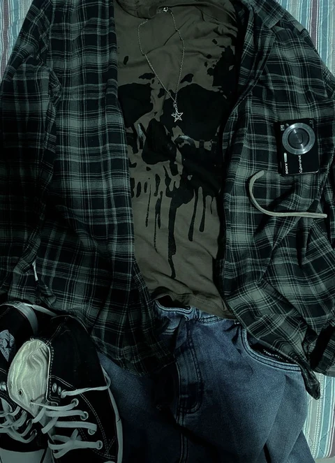 A mannequin dressed in a plaid shirt and jeans.