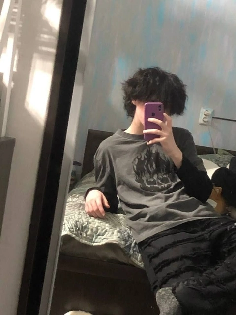 A woman taking a picture of herself in a mirror.