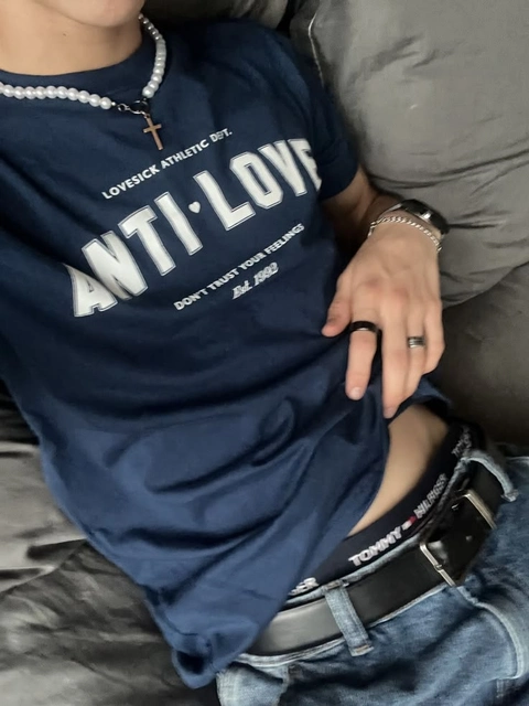 A man wearing a black shirt that says anti-love.