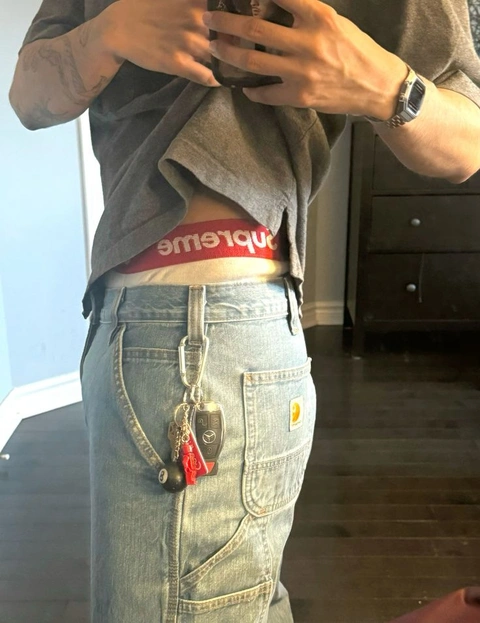 A man taking a picture of himself in a mirror.