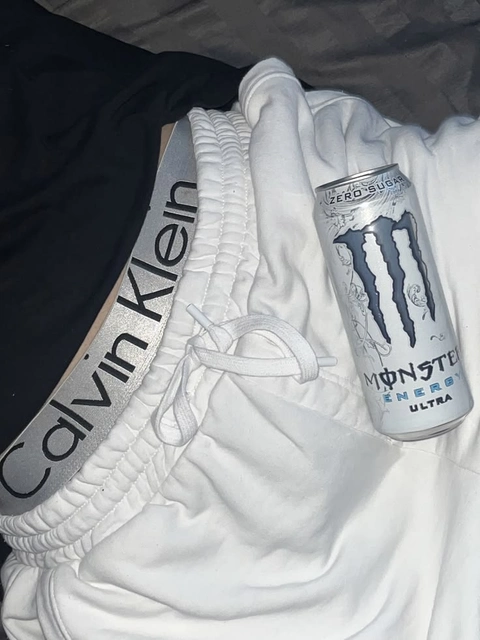 A can of Calvin Klein energy drink sitting on top of a white towel.
