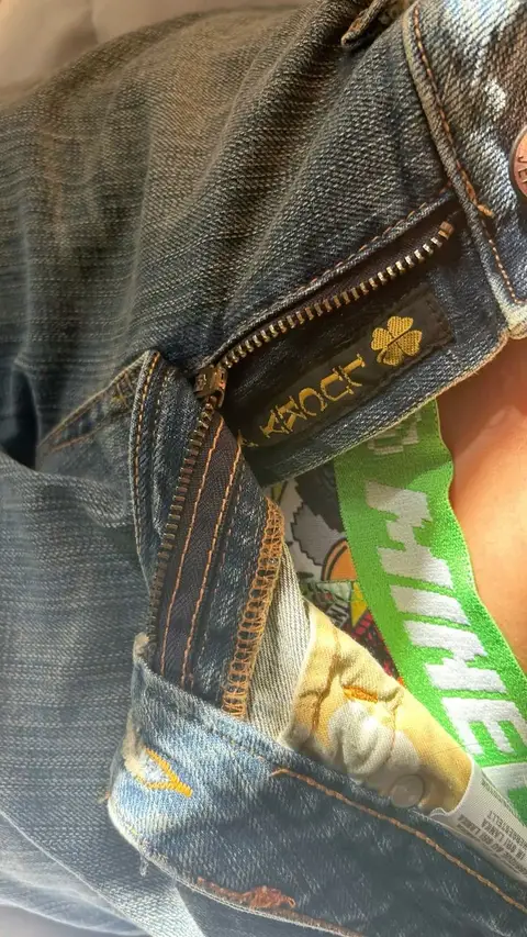 A close up of a person wearing a black jacket.