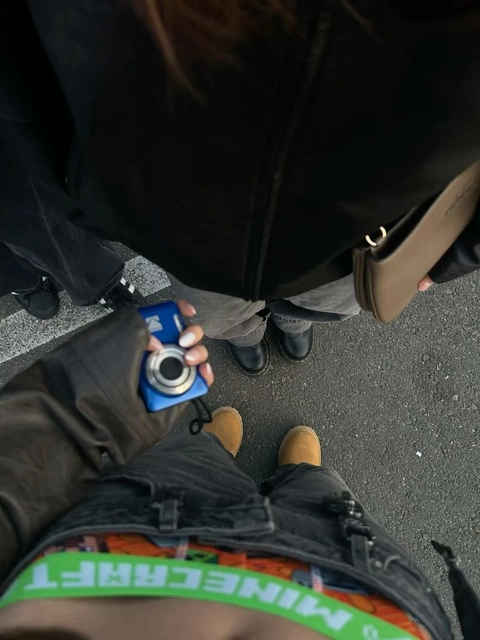 A person taking a picture of themselves with a camera.