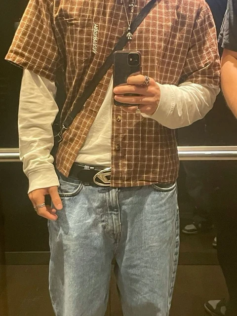 A man taking a picture of himself in a mirror.