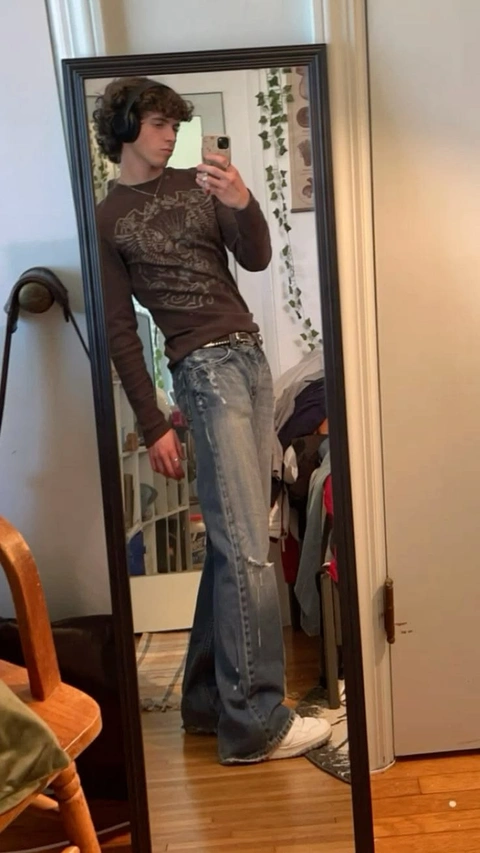 A man taking a picture of himself in a mirror.