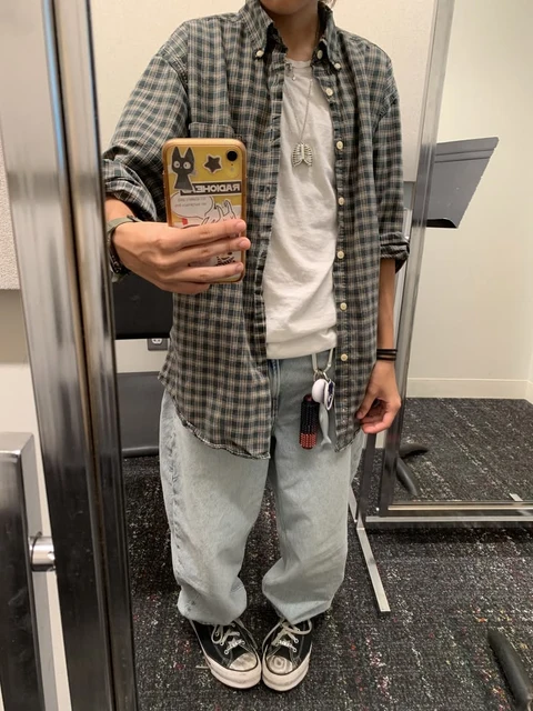 A man taking a selfie in a mirror.