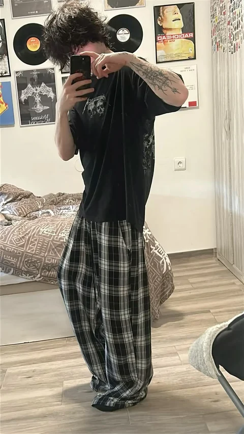A man taking a picture of himself in a mirror.
