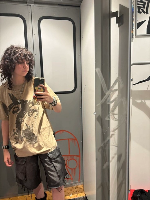 A woman taking a picture of herself in a mirror.