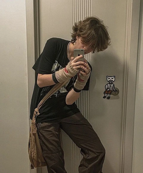 A woman taking a picture of herself in a mirror.