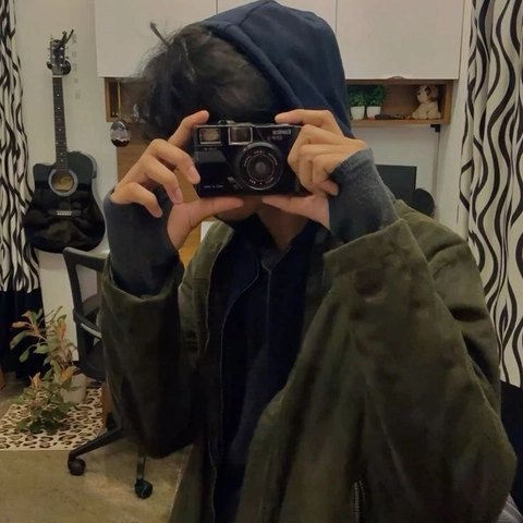 A person taking a picture of themselves in a mirror.